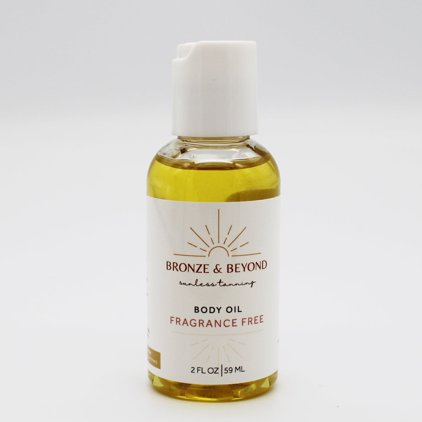 Bottle of Bronze & Beyond tan safe body oil on a white background