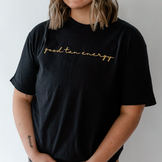 woman wearing good tan energy t shirt