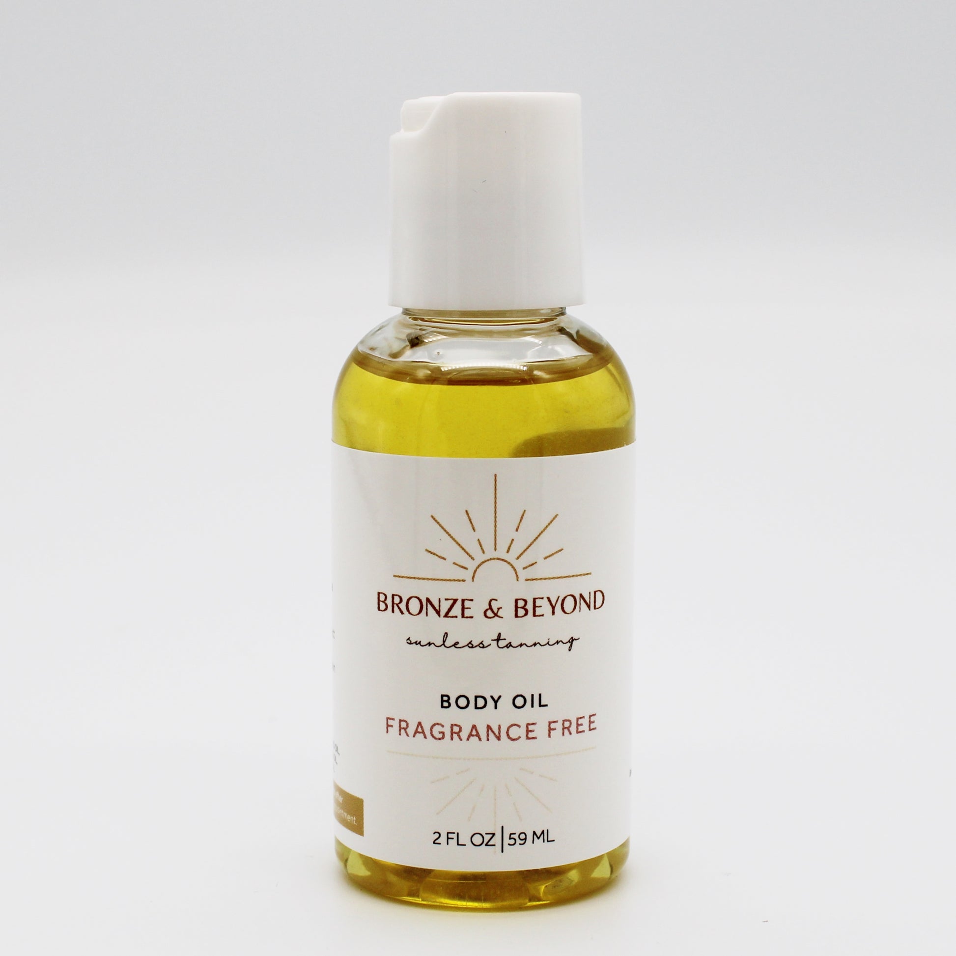 Bottle of Bronze & Beyond tan safe body oil on a white background